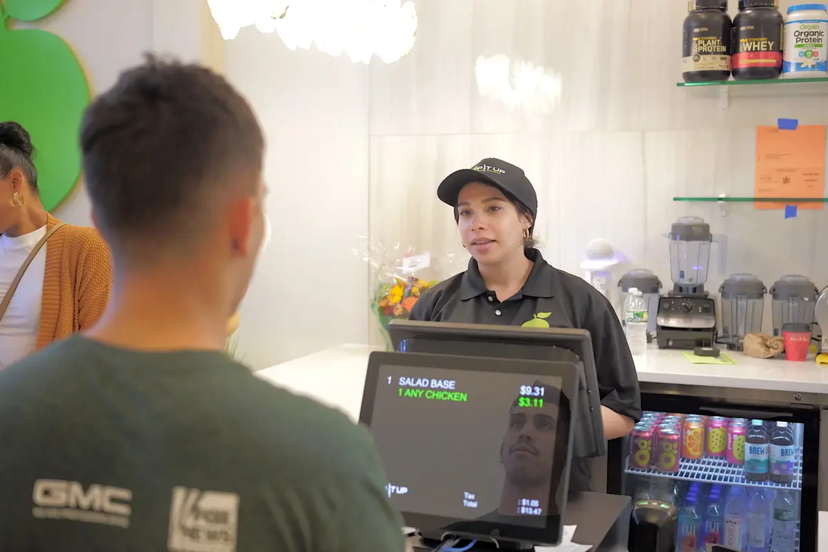 Chop It Up staff serving a customer